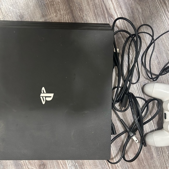 PS4 Pro with one controller and 5 games with travel bag